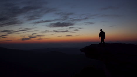 Hiker-approaches-McAfee-Knob-at-sunrise