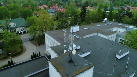 Aerial-view-of-a-roof-of-a-school-building-with-cellular-network-antennas