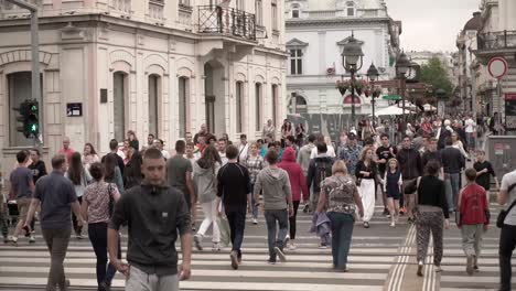 Pedestrians-crossing-a-cross-walk-in-Belgrade,-Serbia