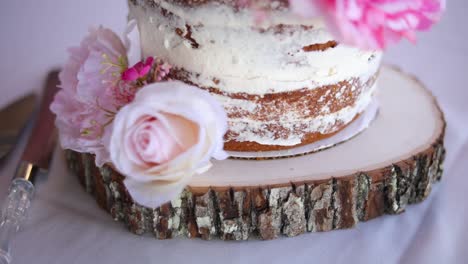 Slow-and-Smooth-moving-shot-circling-a-beautiful-pink-and-white-wedding-cake