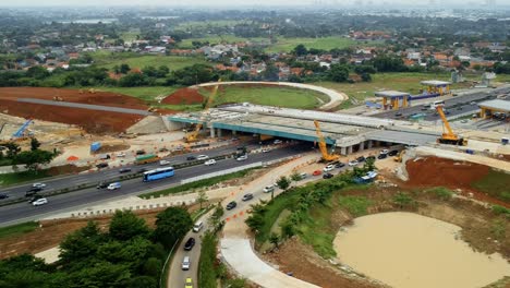 Aerial-drone-unveiling-shot-of-overpass-or-bridge-construction-at-highway-or-freeway-near-Alam-Sutera