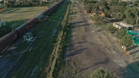 Aerial-Of-A-Freight-Train-Passing-Through-Mexican-northern-Countryside