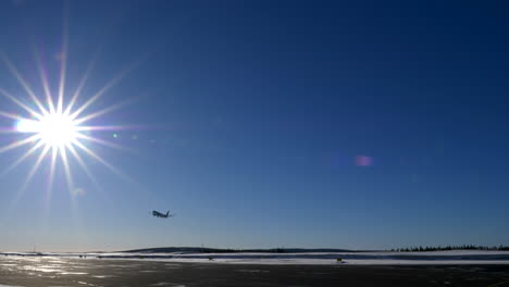 Airplane-Take-Off,-Blue-Sky-Bright-Sun,-Kittila-Airport,-Finland
