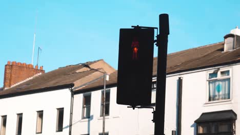 Traffic-lights-changing-from-a-pedestrians-point-of-view-stood-waiting-to-cross