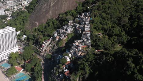 Aerial-approach-and-tilt-down-towards-the-small-Rio-de-Janeiro-favela-Chacara-on-the-slopes-of-the-Two-Brothers-mountain-next-to-the-bigger-Vidigal-shanty-town