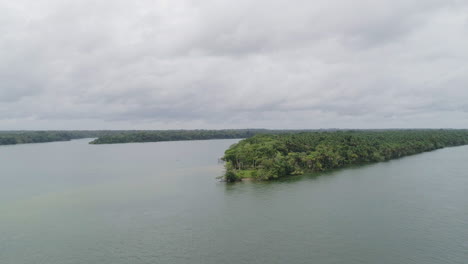 Aerial-shot-over-Amazon-river-approaching-forest---Para,-Brazil