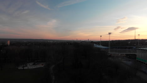 AERIAL-DOLLY-OUT:-Drone-flying-above-Crystal-Palace-Football-Stadium-during-sunset