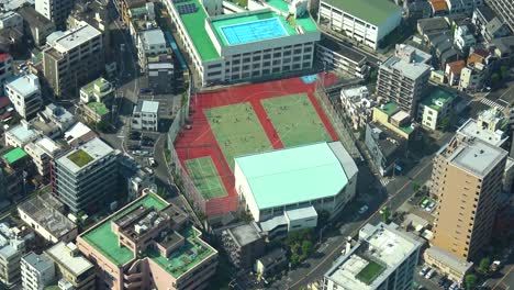 Aerial-view-of-people-playing-on-the-soccer-field-from-from-Skytree-tower