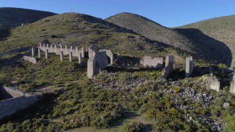 Aerial-drone-shot-of-some-ruins-at-Pueblo-Fantasma-in-Real-de-Catorce,-San-Luis-Potosi,-Mexico