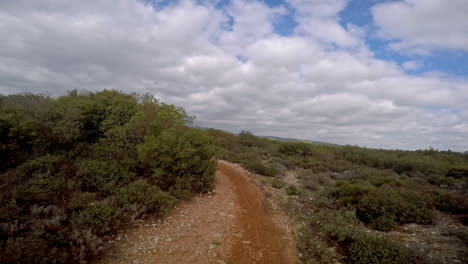 POV-Action-camera-footage-riding-a-dirt-bike-on-single-track-at-Parnitha-Mountain,-Greece