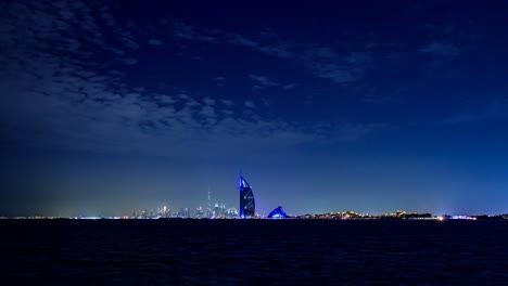 This-is-a-4K-timelapse-video-taken-in-Palm-Jumeirah-and-showing-Burj-Al-Arab,-Burj-Khalifa-and-the-stunning-Dubai-skyline-at-night