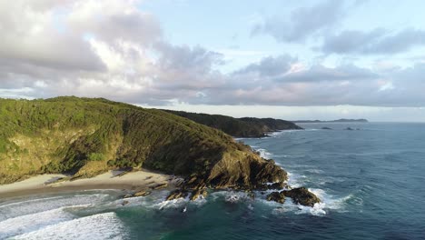Sunrise-aerial-footage-of-secret-beaches-and-headland-in-a-tropical-paradise