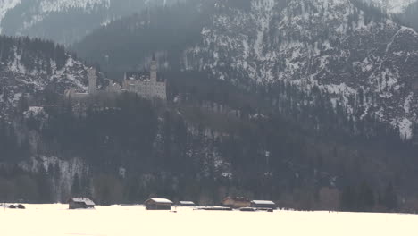 Neuschwanstein-castle-in-the-distance-view-from-a-street-of-Schwangau-4k-footage