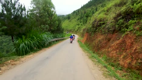 Following-a-motorcycle-weaving-through-traffic-leaving-Ha-Giang-city