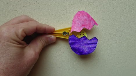Easter-Egg-Clothespin-Craft-for-Kids-with-surprise-inside-as-it-opens