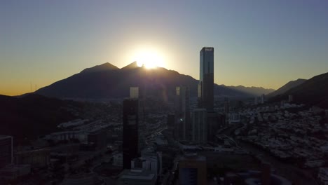 Aerial-shot-of-the-sunrise-in-the-Cerro-de-la-Silla-with-the-San-Pedro-Skyline