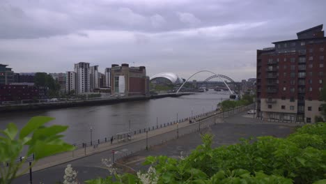 Overcast-evening-view-across-Newcastle-upon-Tyne-from-a-raised-area-showing-the-Baltic-Art-center,-Sage-theater-and-the-famous-bridges