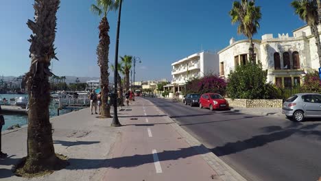Cycling-along-the-harbour-of-the-greek-town-of-Kos
