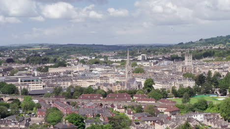 Aerial-Truck-Shot-of-the-City-of-Bath,-including-Bath-Abbey---GWR-Train,-in-the-South-West-of-England-on-a-Sunny-Summer’s-Day-with-Narrow-Crop