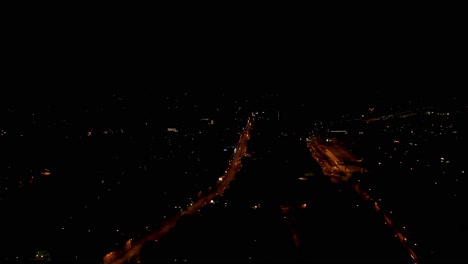 Drone-Shot-of-the-streets-of-Goettingen-at-night,-Lower-Saxony,-Germany,-Europe
