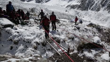 A-Himalayan-mountaineer-crossing-caravans-by-ladder-crossing