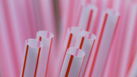 Macro-close-up,-red-and-white-plastic-drinking-straws