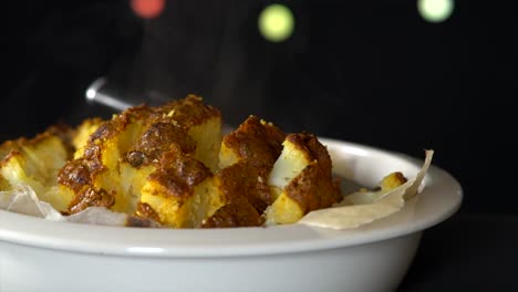 Steamy-roasted-Cauliflowers-with-some-lights-and-a-black-background
