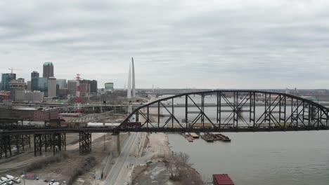 Slow-motion-aerial-parallax-of-train-crossing-bridge-over-Mississippi-River