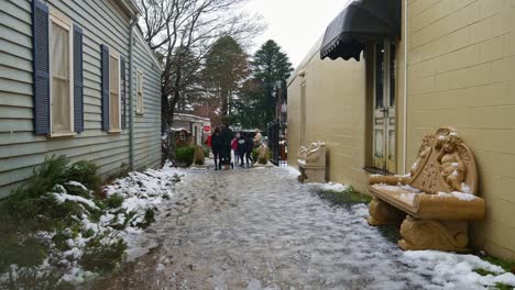 People-walk-though-a-laneway-in-Trentham-after-snow