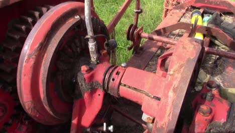 Greasing-the-knotter-drive-on-an-old-baler-for-making-small-square-bales