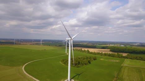 Aerial-view-of-windmills-and-farmland-on-a-picturesque-summer-day