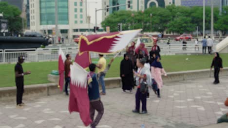 Man-waiving-Qatari-flag-on-National-Day