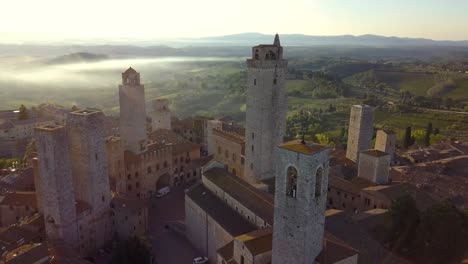 San-Gimignano-Tuscany-Italy-with-Torre-Grossa-landmark-in-the-center,-Aerial-circular-shot