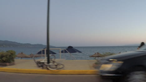 View-from-a-side-window-of-a-car-at-Kalamata-beach,-Greece