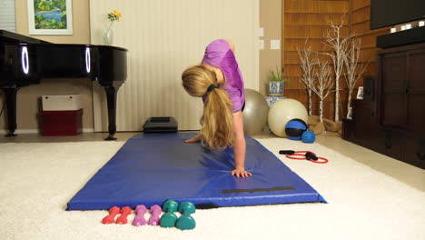 Older-caucasian-women-doing-a-side-stretch-to-work-her-obliques-in-a-home-gym