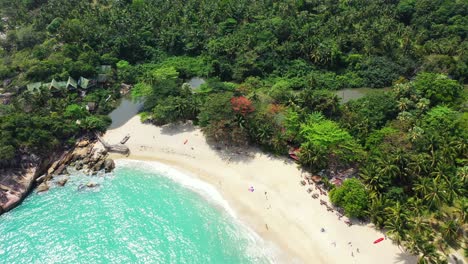 Ao-than-sadet-bay-with-sandy-beach,-turquoise-sea-water-and-exotic-trees