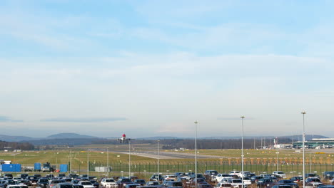 Wide-angle-static-shot-of-an-Edelweiss-A330-accelerating-and-taking-off-from-Zurich-airport-,-in-Switzerland