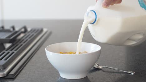 Pouring-milk-into-a-bowl-of-cereal