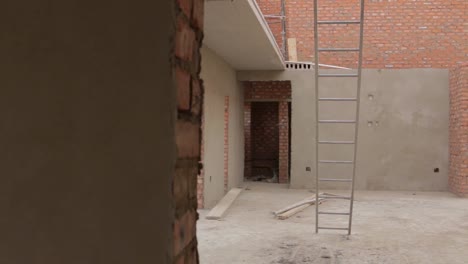 Pan-of-new-house-construction-site-work-in-progress