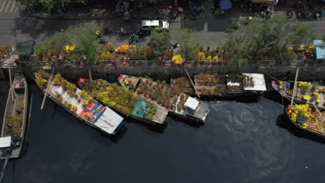 Top-down-Aerial-tracking-view-of-floating-flower-market-in-Saigon-or-Ho-Chi-Minh-City-in-Vietnam