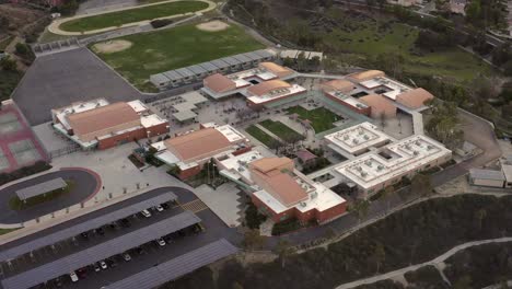 Santa-Clarita-Junior-High-School,-aerial-panning-view-with-solar-panels