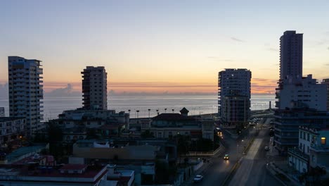 Beautiful-Aerial-Time-lapse-view-of-the-residential-neighborhood-in-the-Havana-City,-Capital-of-Cuba,-during-a-vibrant,-colorful-and-cloudy-sunrise