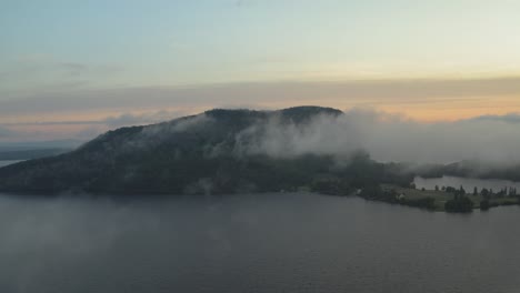 Sunrise-fog-surrounding-Mount-Kineo-over-Moosehead-Lake-aerial