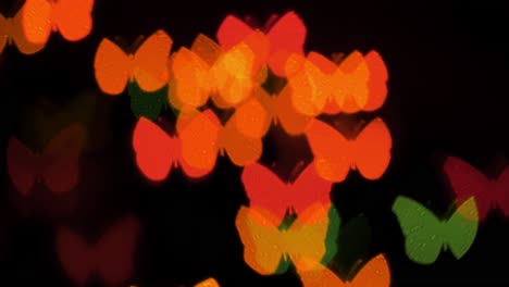 Beautiful-butterfly-shape-bokeh-from-flashing-LED-lights,-summer,-spring,-holiday-background-concept,-copyspace