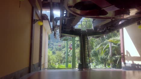 Cable-car-ride-station-on-Ba-Na-Hills-headed-to-Sunworld-Amusement-park,-Inside-cabin-view