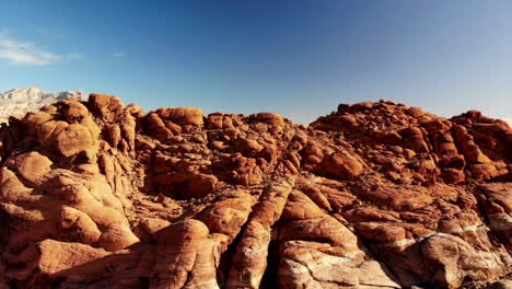 Climbing-drone-footage-of-red-sandstone-mountains-at-Red-Rock-Canyon-Park-near-Las-Vegas