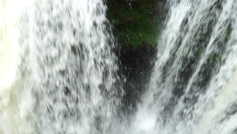 Camera-filming-down-into-a-large-waterfall-in-Java