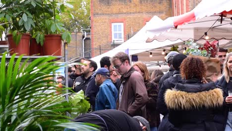 A-street-vendor-selling-exotic-plants-at-the-famous-Columbia-Road-Flower-Market