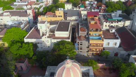 Top-Down-Reveal-Dolly-shot-of-Our-Lady-Angeles-Church-on-an-early-morning-near-the-french-town,-Puducherry-shot-with-a-drone-in-4k