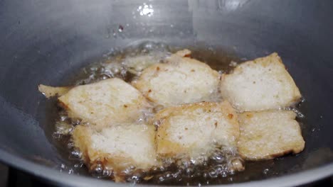 frying-tofu-with-edible-oil